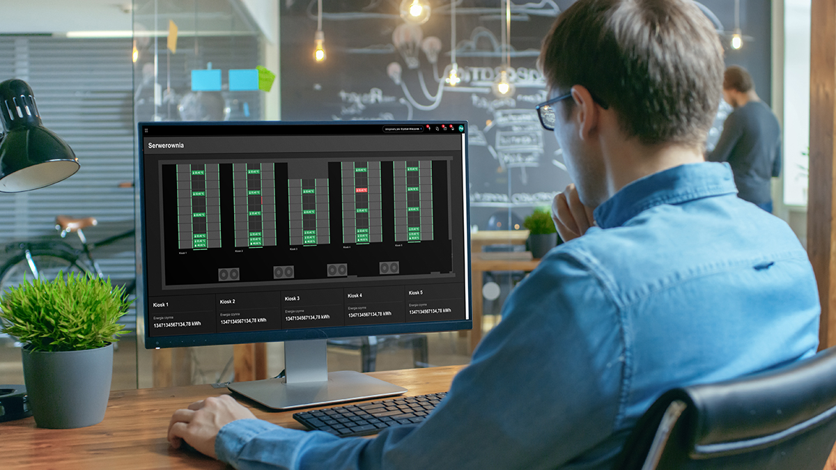 Financier Works on a Personal Computer Showing Statistics, Graph